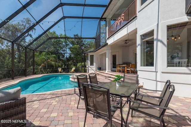 13648 Marsh Harbor Dr N, Jacksonville, FL 32225 - outdoor pool with outdoor dining space, a patio area, a lanai, and a ceiling fan