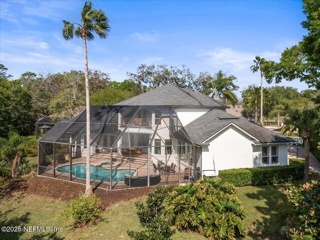 13648 Marsh Harbor Dr N, Jacksonville, FL 32225 - rear view of property featuring an outdoor pool, a shingled roof, a patio area, and glass enclosure