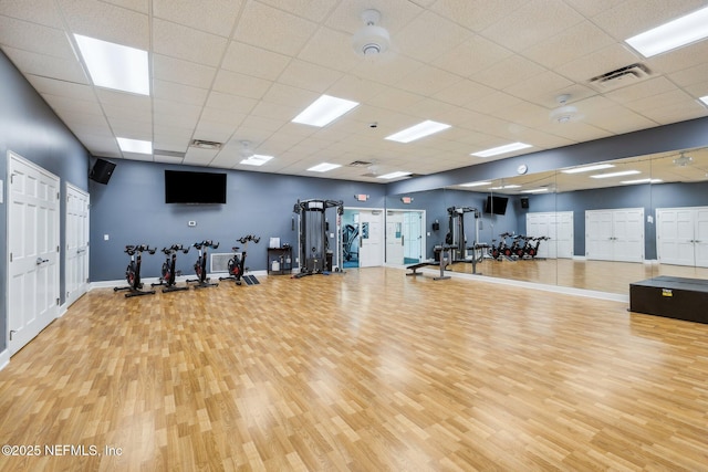 13648 Marsh Harbor Dr N, Jacksonville, FL 32225 - exercise room featuring visible vents, baseboards, a paneled ceiling, and wood finished floors