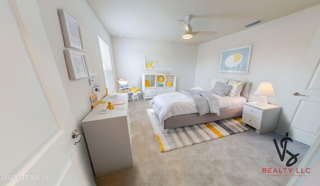 bedroom with visible vents, ceiling fan, and carpet floors