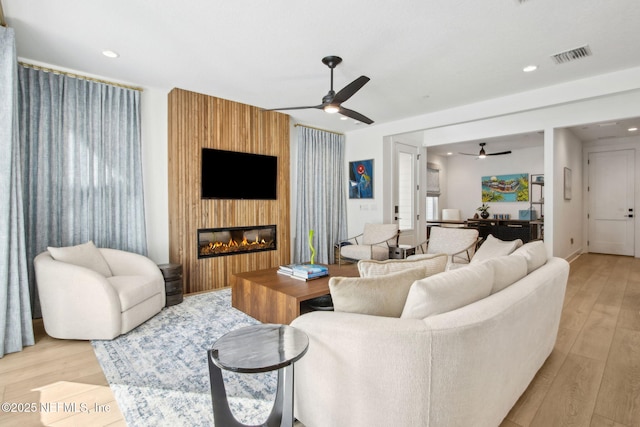 157 Oak Pk Dr, Saint Johns, FL 32259 - living area featuring a ceiling fan, light wood-type flooring, recessed lighting, and a large fireplace