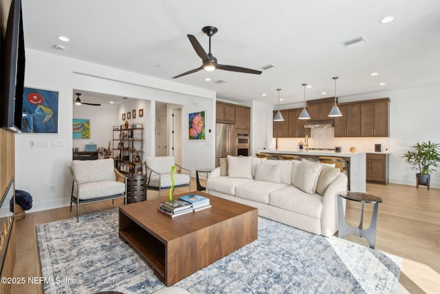 157 Oak Pk Dr, Saint Johns, FL 32259 - living area with ceiling fan, light wood-style flooring, recessed lighting, and baseboards
