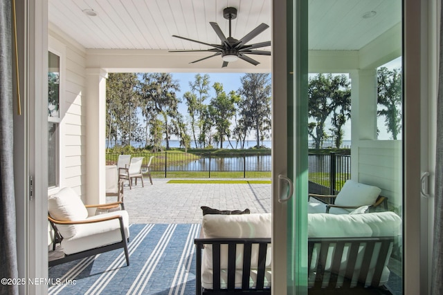 157 Oak Pk Dr, Saint Johns, FL 32259 - doorway to outside featuring a water view, ceiling fan, wooden ceiling, and healthy amount of natural light