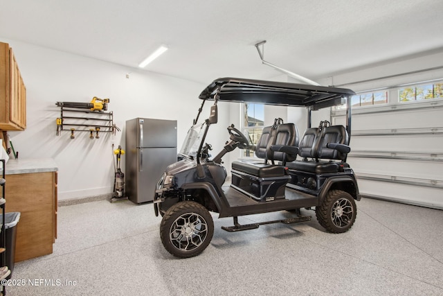 157 Oak Pk Dr, Saint Johns, FL 32259 - garage with freestanding refrigerator and baseboards