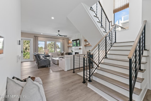 3516 1st St S, Jacksonville Beach, FL 32250 - stairway featuring a fireplace, recessed lighting, and wood finished floors