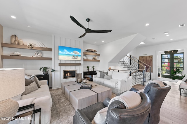 3516 1st St S, Jacksonville Beach, FL 32250 - living area featuring wood finished floors, visible vents, built in features, ceiling fan, and a large fireplace