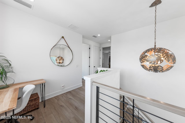 3516 1st St S, Jacksonville Beach, FL 32250 - hallway with recessed lighting, visible vents, a chandelier, wood finished floors, and an upstairs landing