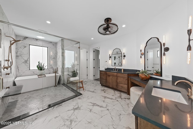3516 1st St S, Jacksonville Beach, FL 32250 - bathroom with recessed lighting, marble finish floor, vanity, a freestanding tub, and a marble finish shower