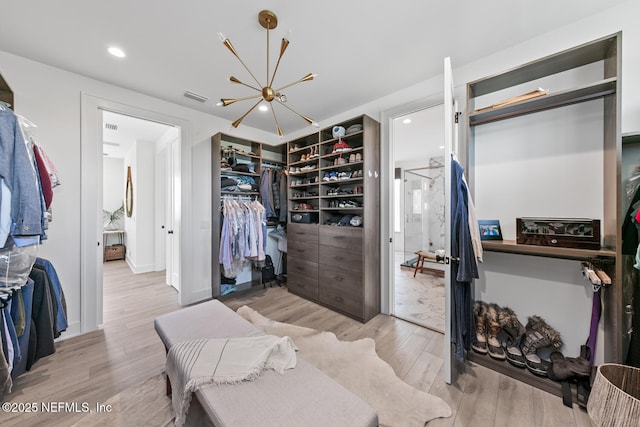3516 1st St S, Jacksonville Beach, FL 32250 - walk in closet with a chandelier, light wood-type flooring, and visible vents