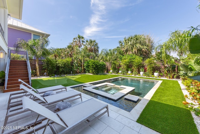 3516 1st St S, Jacksonville Beach, FL 32250 - view of pool with a patio, an in ground hot tub, a fenced backyard, and stairs