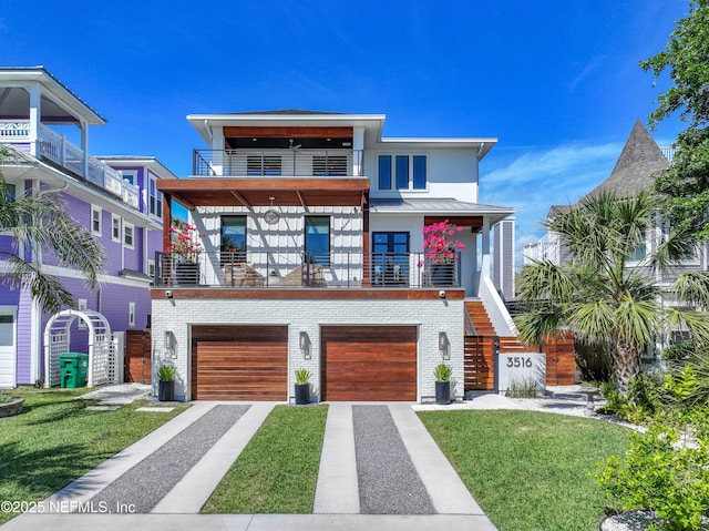 3516 1st St S, Jacksonville Beach, FL 32250 - modern home featuring an attached garage, a balcony, brick siding, driveway, and a standing seam roof