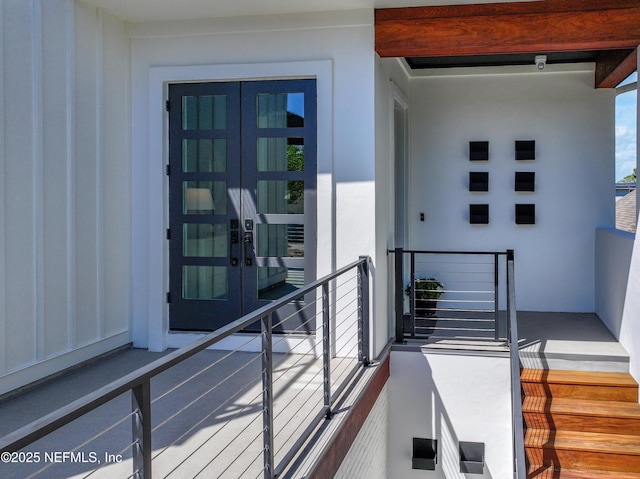3516 1st St S, Jacksonville Beach, FL 32250 - property entrance with a balcony, stucco siding, and french doors
