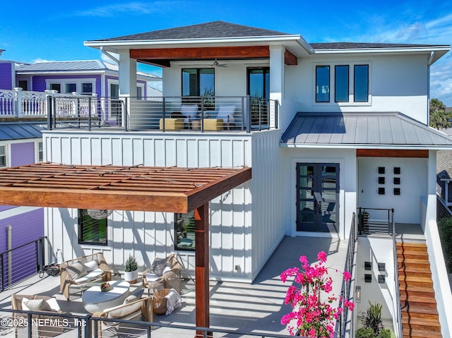 3516 1st St S, Jacksonville Beach, FL 32250 - rear view of property with a balcony, a standing seam roof, french doors, and stucco siding