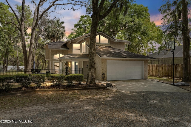 97282 Yorkshire Dr, Yulee, FL 32097 - mid-century home featuring driveway, fence, and stucco siding