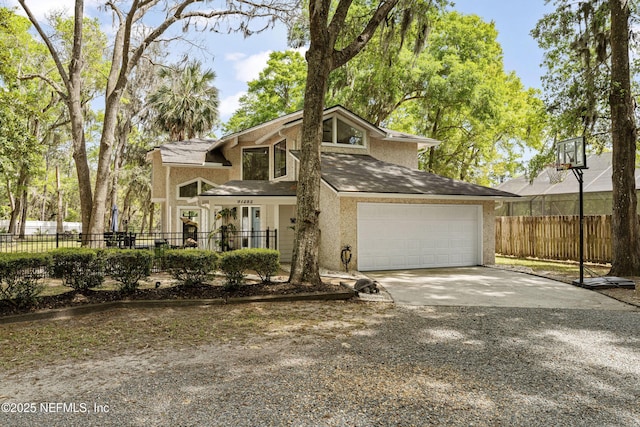 97282 Yorkshire Dr, Yulee, FL 32097 - view of front of house featuring driveway, fence, and stucco siding