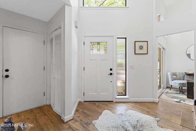 97282 Yorkshire Dr, Yulee, FL 32097 - foyer entrance featuring a towering ceiling, wood finished floors, and baseboards
