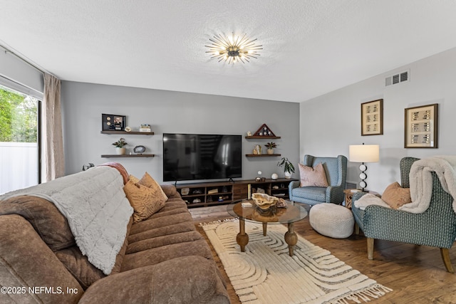 97282 Yorkshire Dr, Yulee, FL 32097 - living area featuring wood finished floors and a textured ceiling