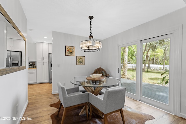 97282 Yorkshire Dr, Yulee, FL 32097 - dining room with a chandelier, recessed lighting, light wood-type flooring, and baseboards