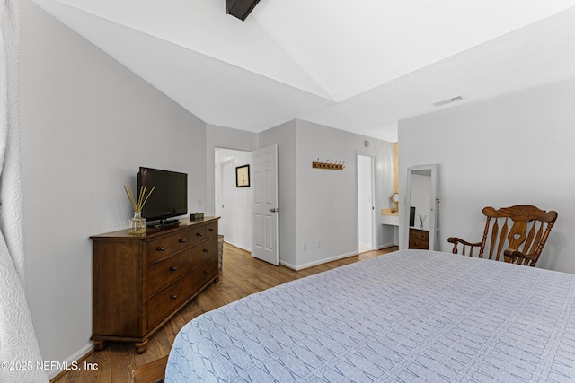 97282 Yorkshire Dr, Yulee, FL 32097 - bedroom featuring wood finished floors, baseboards, and high vaulted ceiling