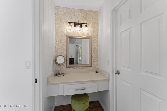 97282 Yorkshire Dr, Yulee, FL 32097 - bathroom with wallpapered walls, wood finished floors, and vanity