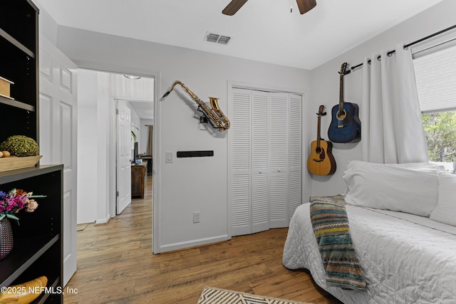 97282 Yorkshire Dr, Yulee, FL 32097 - bedroom featuring light wood-style floors, a closet, baseboards, and ceiling fan