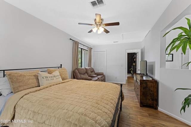97282 Yorkshire Dr, Yulee, FL 32097 - bedroom featuring wood finished floors, baseboards, attic access, a ceiling fan, and a closet