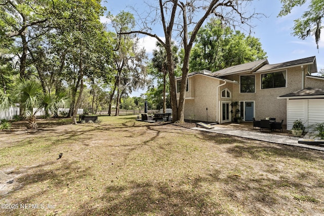 97282 Yorkshire Dr, Yulee, FL 32097 - view of green lawn featuring a patio and a hot tub