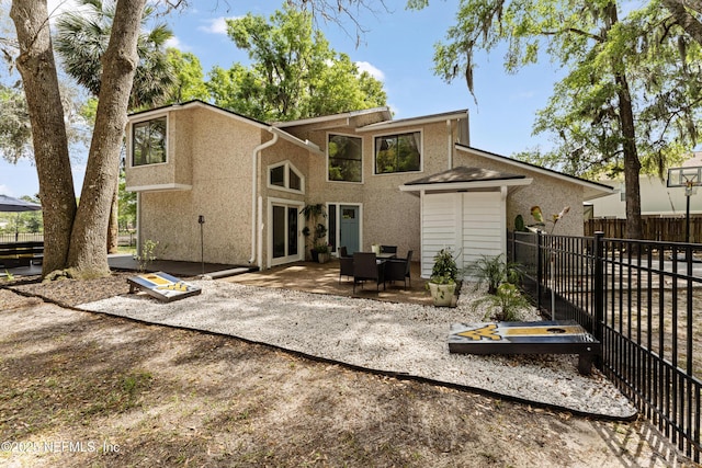 97282 Yorkshire Dr, Yulee, FL 32097 - back of house with a patio, stucco siding, and fence