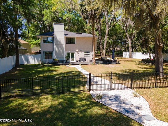 97282 Yorkshire Dr, Yulee, FL 32097 - view of front facade featuring a wooden deck, a chimney, and stucco siding