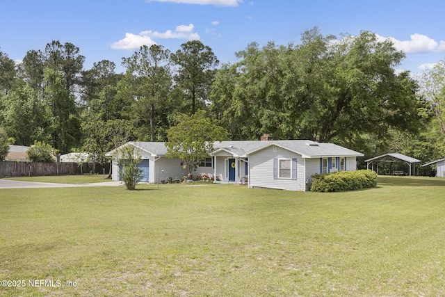 ranch-style house featuring a garage, a carport, a front yard, fence, and concrete driveway