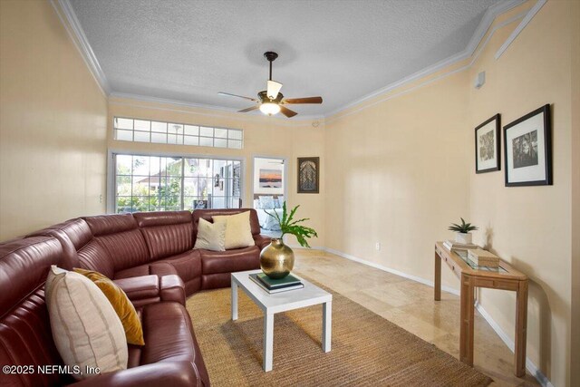 1886 Mourning Dove Ln, Jacksonville Beach, FL 32250 - living area with a ceiling fan, ornamental molding, a textured ceiling, and baseboards