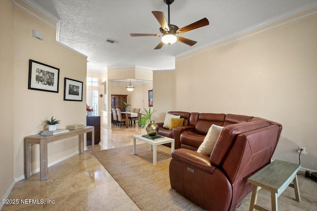 1886 Mourning Dove Ln, Jacksonville Beach, FL 32250 - living room with a ceiling fan, baseboards, crown molding, and light marble finish floors