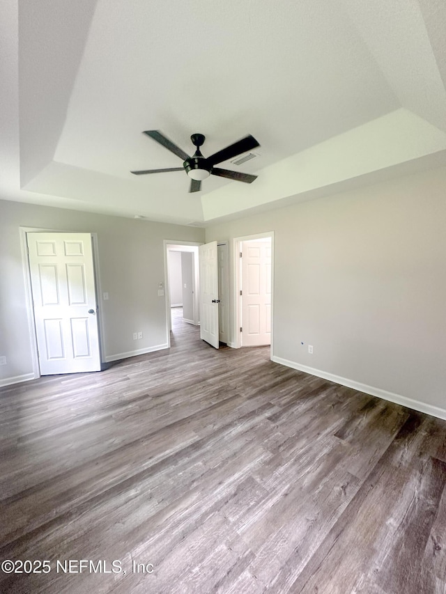 116 Moseley Ave, Palatka, FL 32177 - unfurnished bedroom with baseboards, wood finished floors, and a ceiling fan