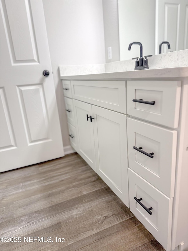 116 Moseley Ave, Palatka, FL 32177 - bathroom featuring wood finished floors and vanity