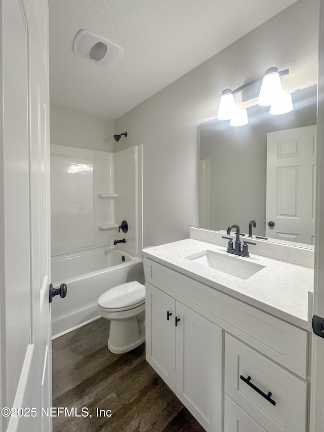 116 Moseley Ave, Palatka, FL 32177 - full bathroom featuring wood finished floors, toilet, vanity, and tub / shower combination