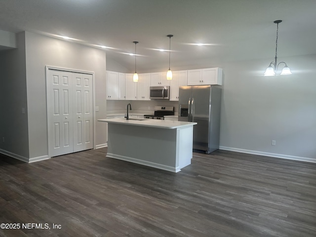 116 Moseley Ave, Palatka, FL 32177 - kitchen featuring stainless steel appliances, baseboards, light countertops, white cabinetry, and lofted ceiling