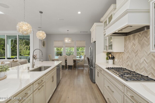 247 Vale Dr, Saint Augustine, FL 32095 - kitchen with tasteful backsplash, a sink, stainless steel appliances, premium range hood, and recessed lighting