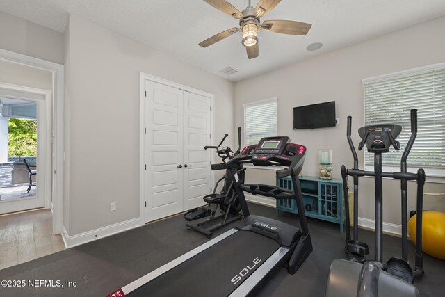 247 Vale Dr, Saint Augustine, FL 32095 - exercise area with baseboards, a ceiling fan, and wood finished floors