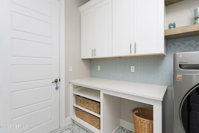 247 Vale Dr, Saint Augustine, FL 32095 - laundry room featuring cabinet space, baseboards, and washer / clothes dryer
