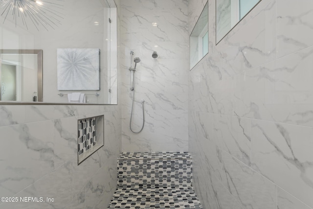 247 Vale Dr, Saint Augustine, FL 32095 - bathroom with an inviting chandelier and a tile shower