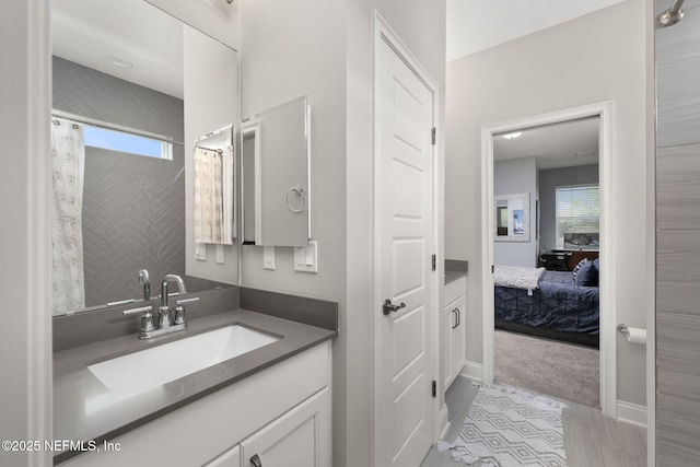 247 Vale Dr, Saint Augustine, FL 32095 - bathroom with plenty of natural light, curtained shower, vanity, and connected bathroom