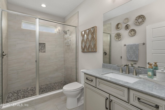 247 Vale Dr, Saint Augustine, FL 32095 - bathroom featuring vanity, toilet, a stall shower, and tile patterned floors