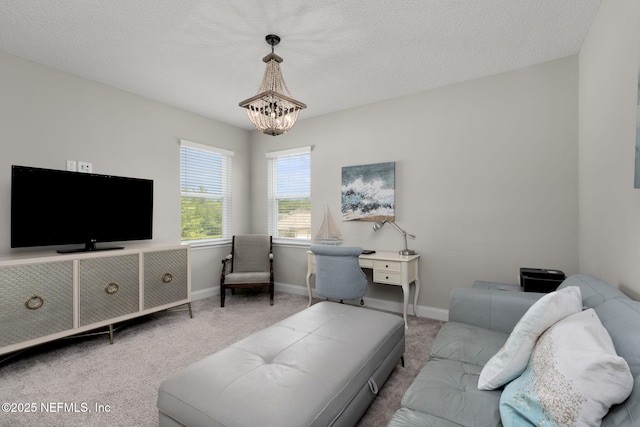 247 Vale Dr, Saint Augustine, FL 32095 - carpeted living area featuring baseboards and an inviting chandelier