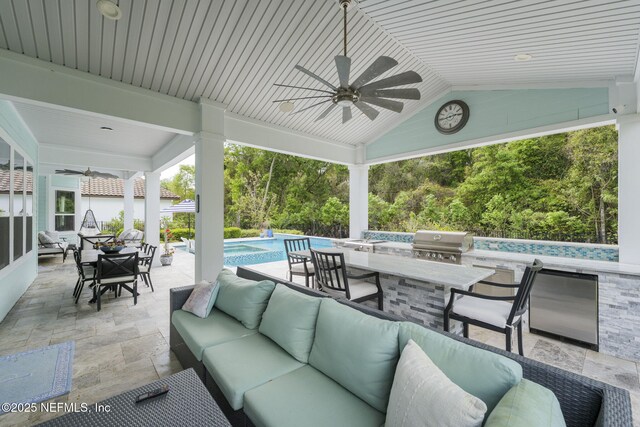 247 Vale Dr, Saint Augustine, FL 32095 - view of patio / terrace with area for grilling, outdoor wet bar, a ceiling fan, and an outdoor hangout area