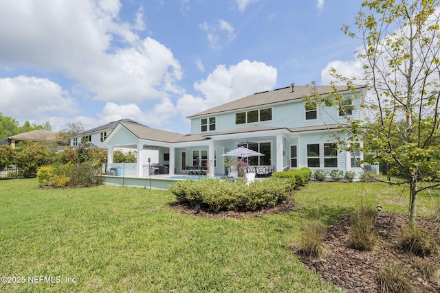 247 Vale Dr, Saint Augustine, FL 32095 - back of property featuring fence, a patio area, and a yard