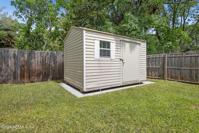 view of shed featuring a fenced backyard
