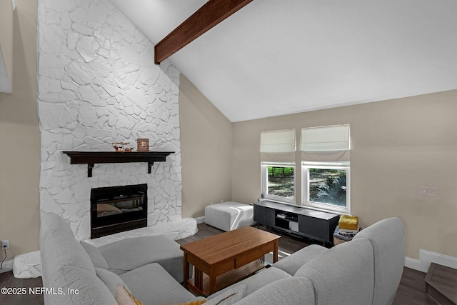 living room featuring dark wood-style flooring, baseboards, lofted ceiling with beams, and a fireplace
