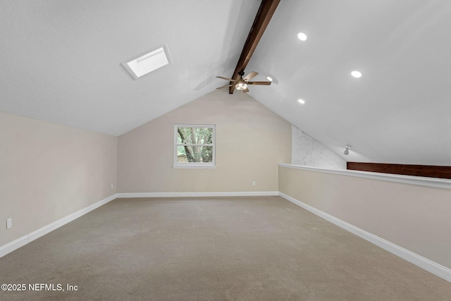 bonus room featuring ceiling fan, baseboards, and lofted ceiling with skylight