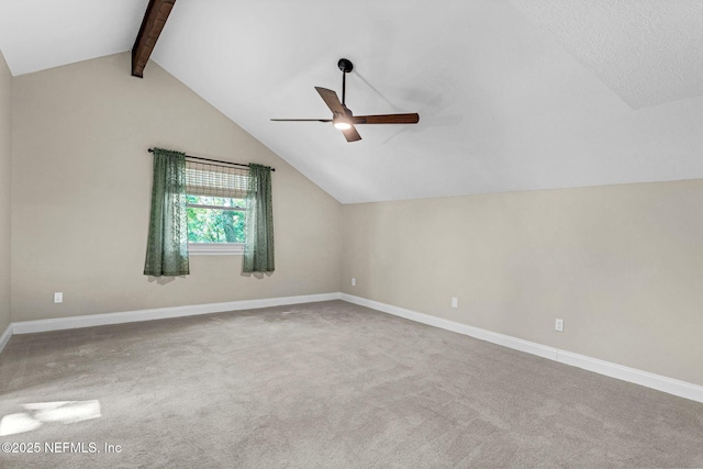 bonus room with a ceiling fan, carpet flooring, baseboards, and vaulted ceiling with beams