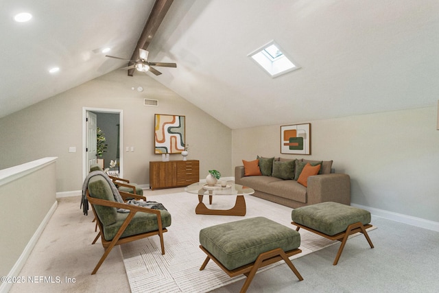 living area with light carpet, a ceiling fan, lofted ceiling with skylight, and visible vents